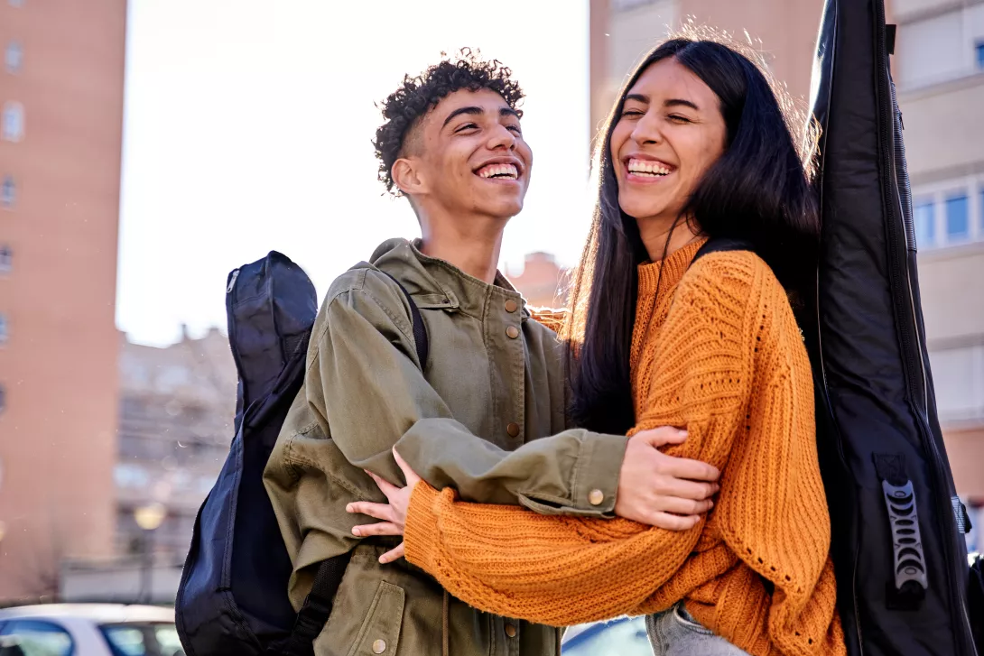 portrait-of-a-beautiful-young-couple-laughing-outd