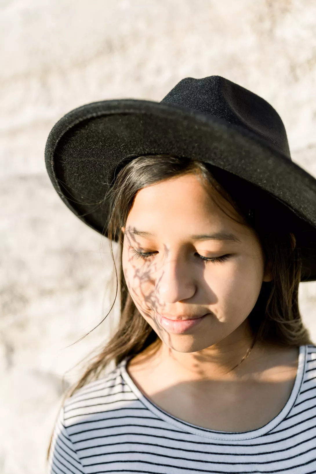portrait-of-young-girl-wearing-a-black-fedora