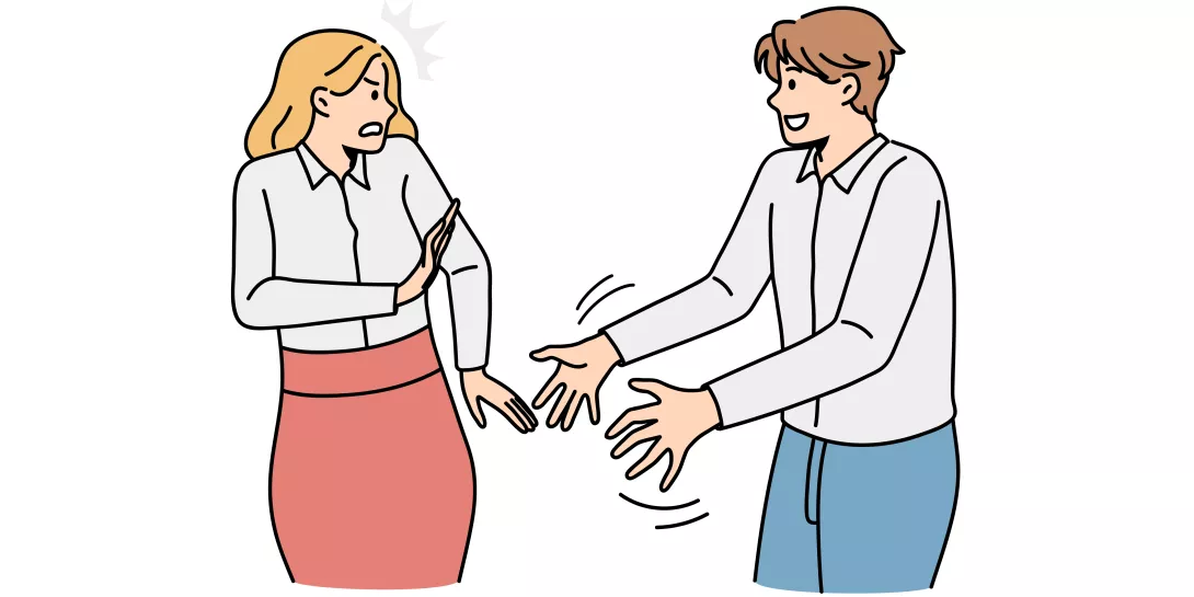 man grabbing at woman who is unhappy about it
